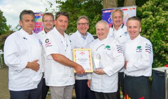 Image of BBQ champion Graham Crump with Ray Hall and judges