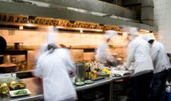 picture of chefs, busy in the kitchen