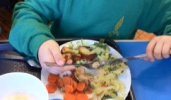 Photo of pupil eating school meals