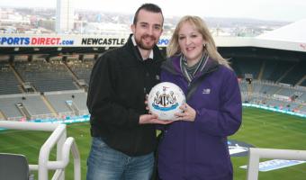 Photo of NUFC fans Claire and Keith Giles, prize winners, VenueMenu app