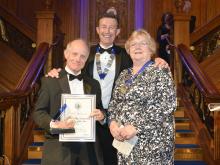 HCA chair Phil Shelley (centre) with winner Chris Lay (left) and Fionnuala Cook, HCA president (right)