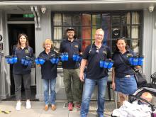 only a pavement away charity water flasks homeless hospitality jobs