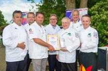 Image of BBQ champion Graham Crump with Ray Hall and judges