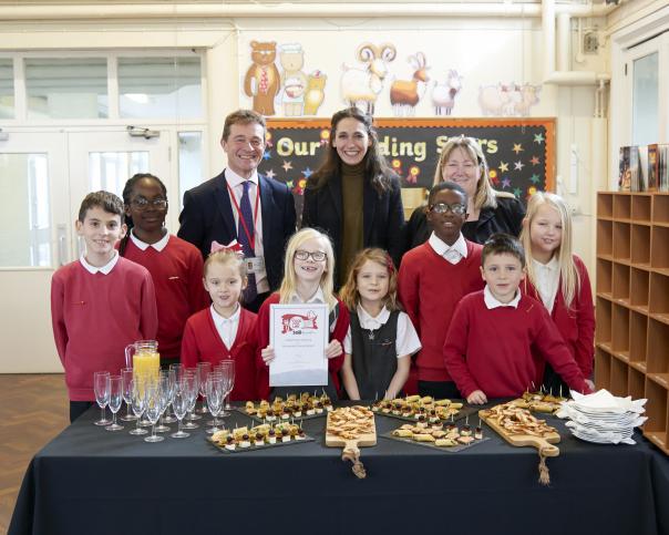 Andrew Saunders with Food For Life Served Here business development manager, Claire Whittington and Normandy Primary School pupils