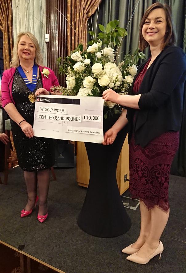 Gaye Bullard and Abby Guilding with the cheque for The Wiggly Worm