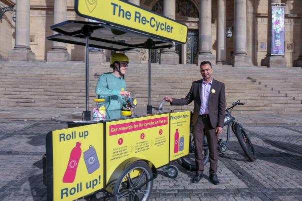 Cllr Mohammed Rafique with a bubble-blowing bin Leeds By Example recycling