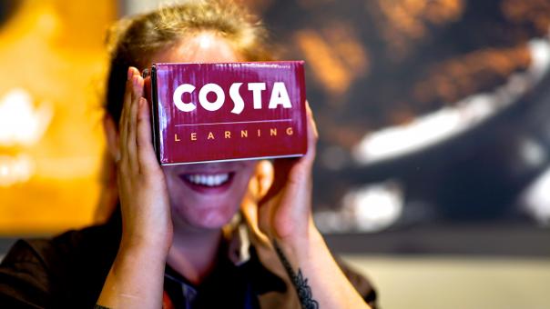 Costa employee using the VR headset