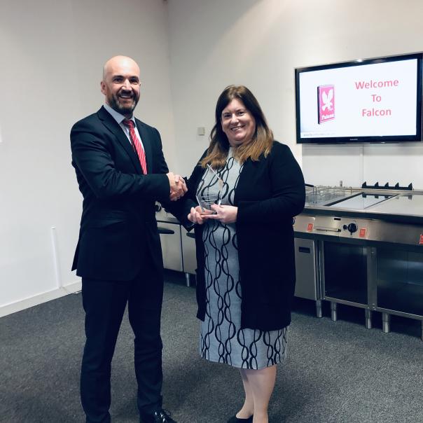 Karen Wallace and Peter Mcallister with the award
