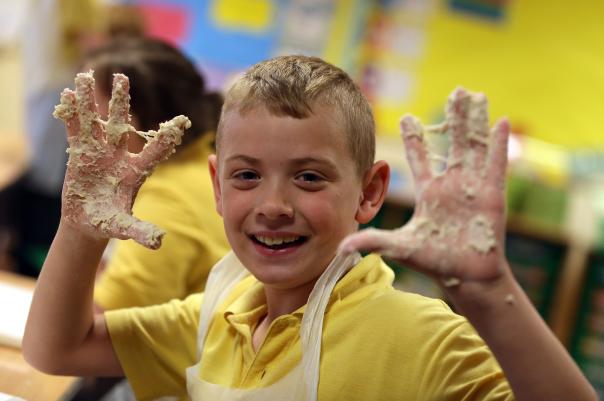 Schoolchildren making their own dough