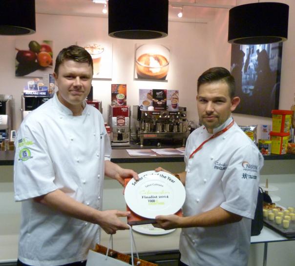 Sam Morgan (left) receiving his prize from Ryan Holmes, Catermasters Development Chef Catermasters Snior Chef of ther Year HCM Group
