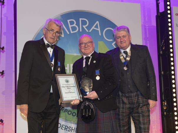 Former HCA chair Stewart McKenzie receiving the Wilma Wilkie Outstanding Service Award from HCA Vice President Mark Hayman and HCA Chair Brian Robb