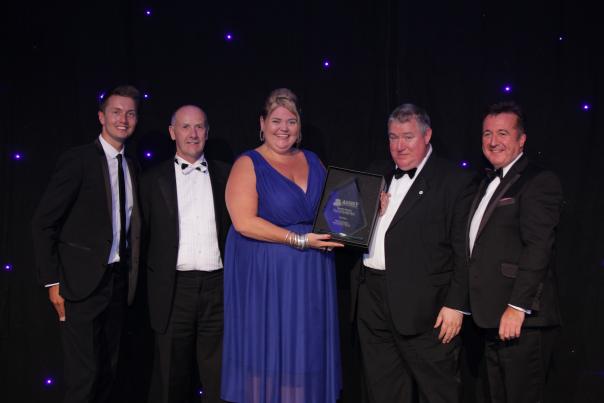 Winner Nikki McNaught is presented with the trophy