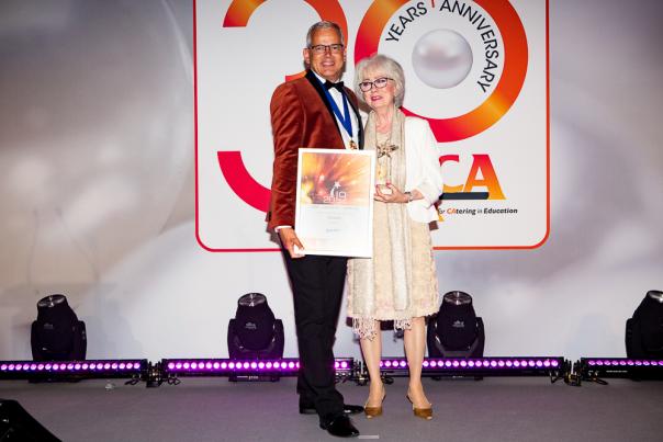 Chair Michael Hales awarding Hazel Fancy The special Contribution Award LACA Awards for Excellence 2019 winners